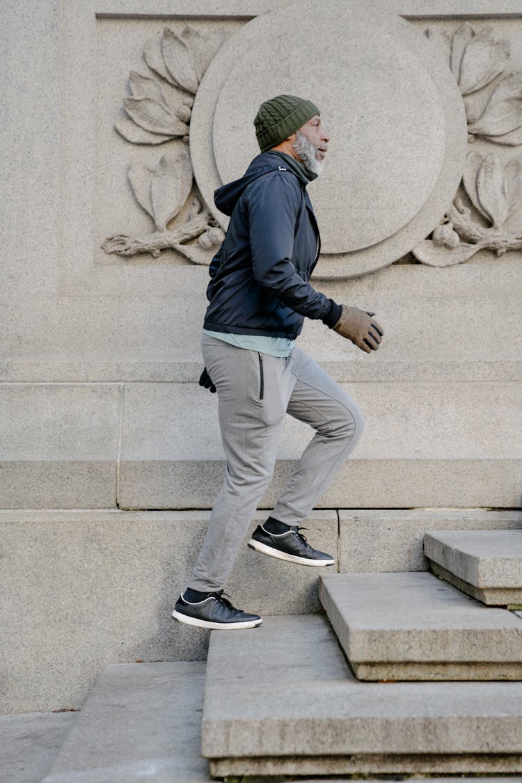 Bearded Man Walking Up Stairs