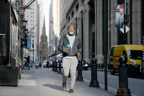 A Man in Activewear Walking in the Street