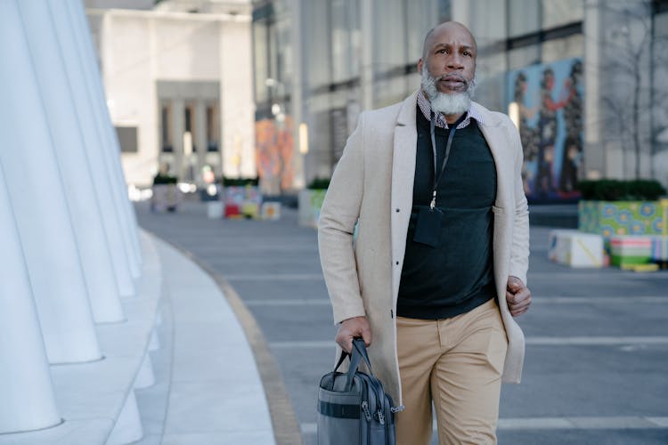 Man With Briefcase Walking Down Street