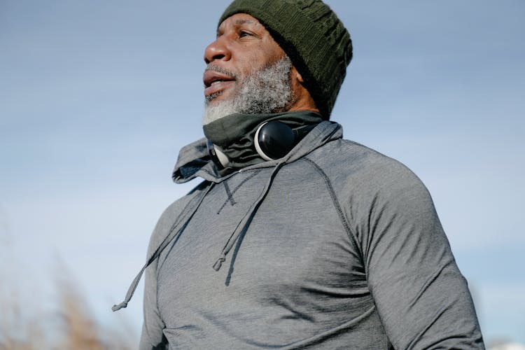 Man In Gray Hoodie Wearing Green Knit Beanie