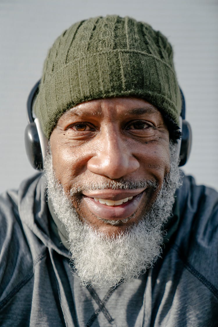 Man In Green Knit Beanie Wearing Headset