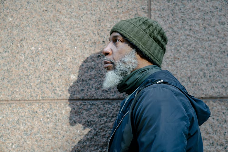 Man In Blue Jacket And Green Knit Beanie