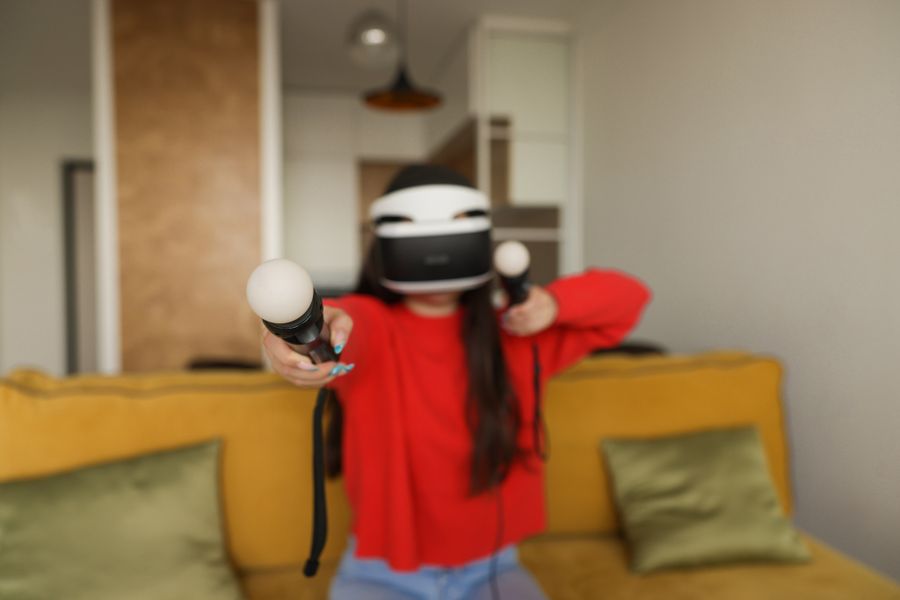 Player wearing a VR headset in a gaming arena