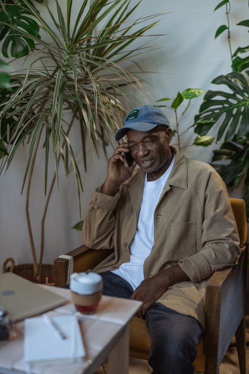 Photo of an Elderly Man Talking on Phone