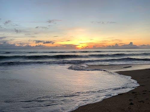 Sea Waves Crashing on Shore during Sunrise