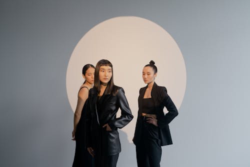 Three Women Wearing Black Clothes 
