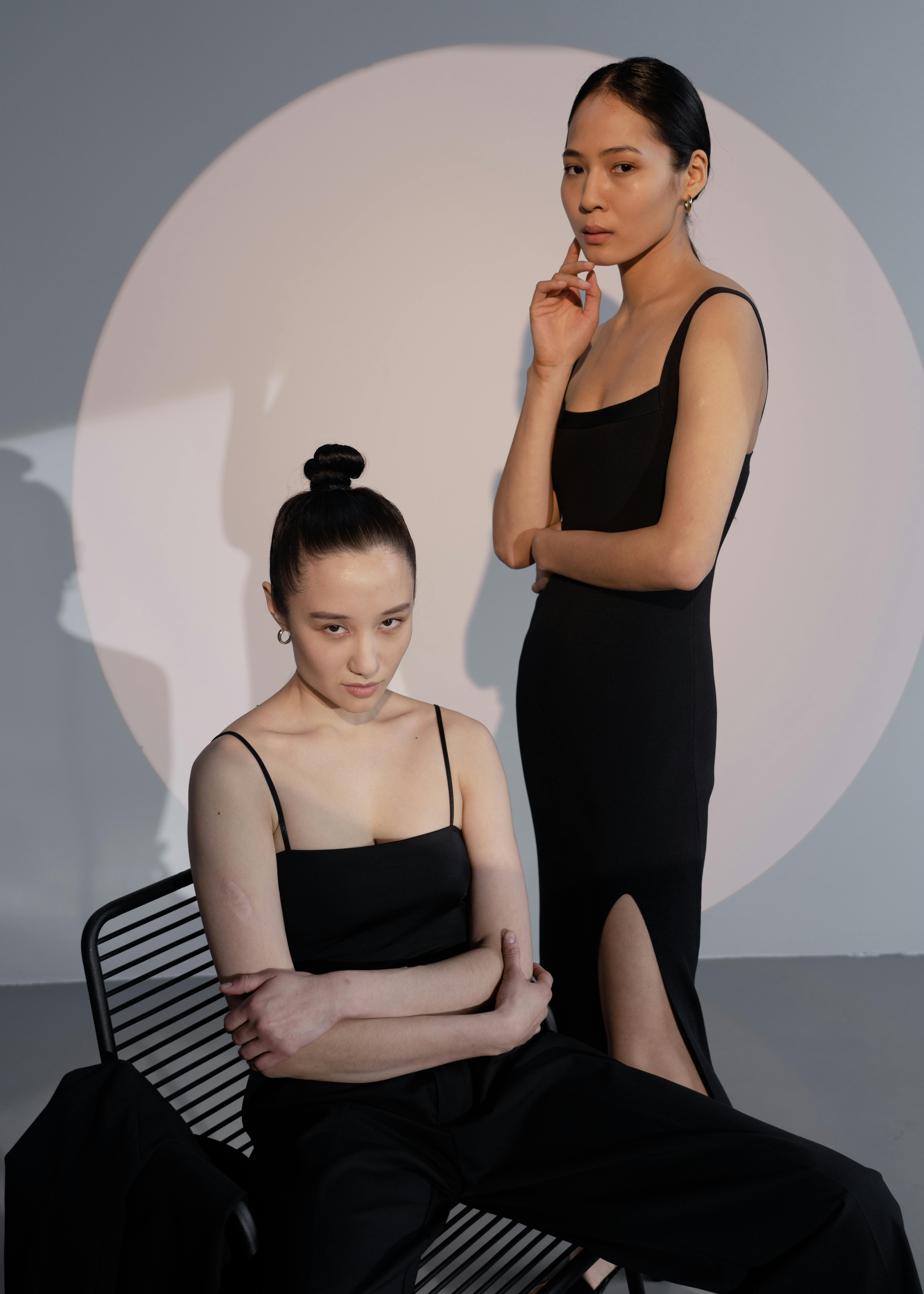 two Fashion Model girls isolated over white background-160767 | Meashots