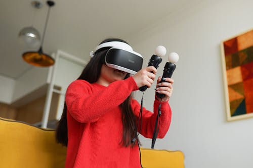 A Woman in Red Sweater Wearing Wearing Virtual Reality Headset