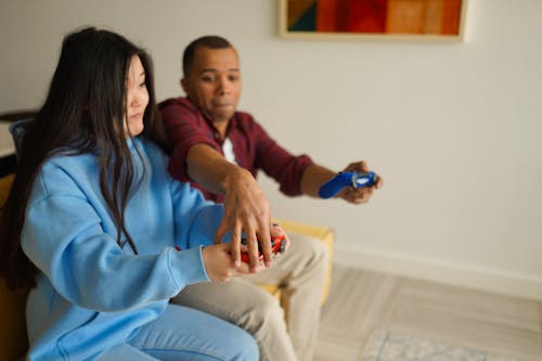 Couple Playing Video Game Together at Home