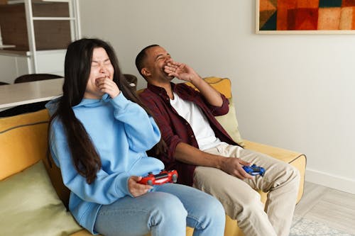 Couple Playing Video Game Together at Home
