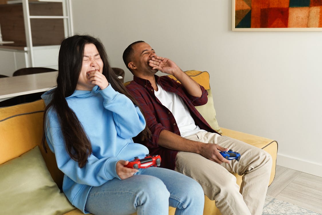 Couple Playing Video Game Together at Home