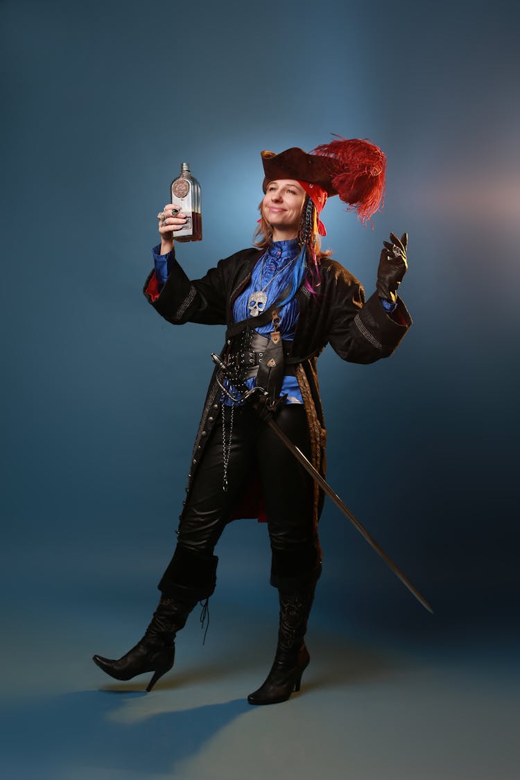 Person In Pirate Costume Holding A Bottle