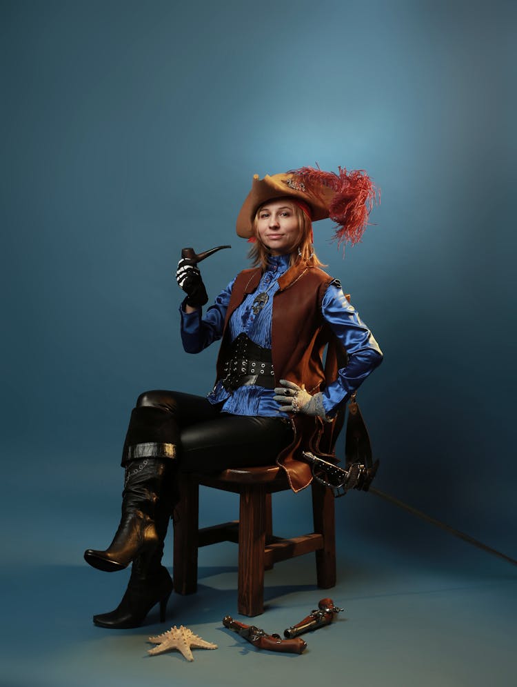 Woman Sitting In Musketeer Costume