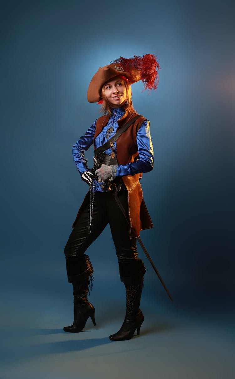 Woman Posing In Musketeer Costume