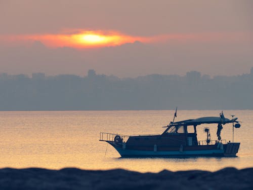 Boat on the Sea during Sunset