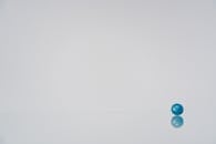 A Blue Round Object on a White Surface