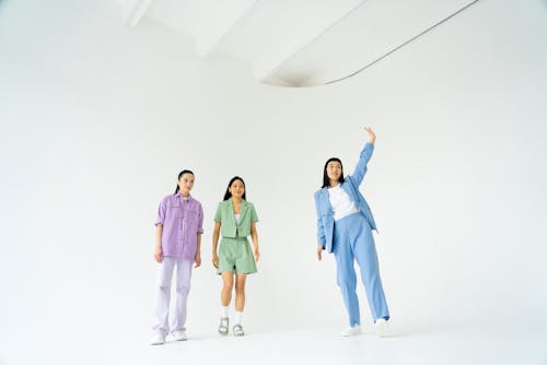 Young Women in Trendy Pastel Outfits
