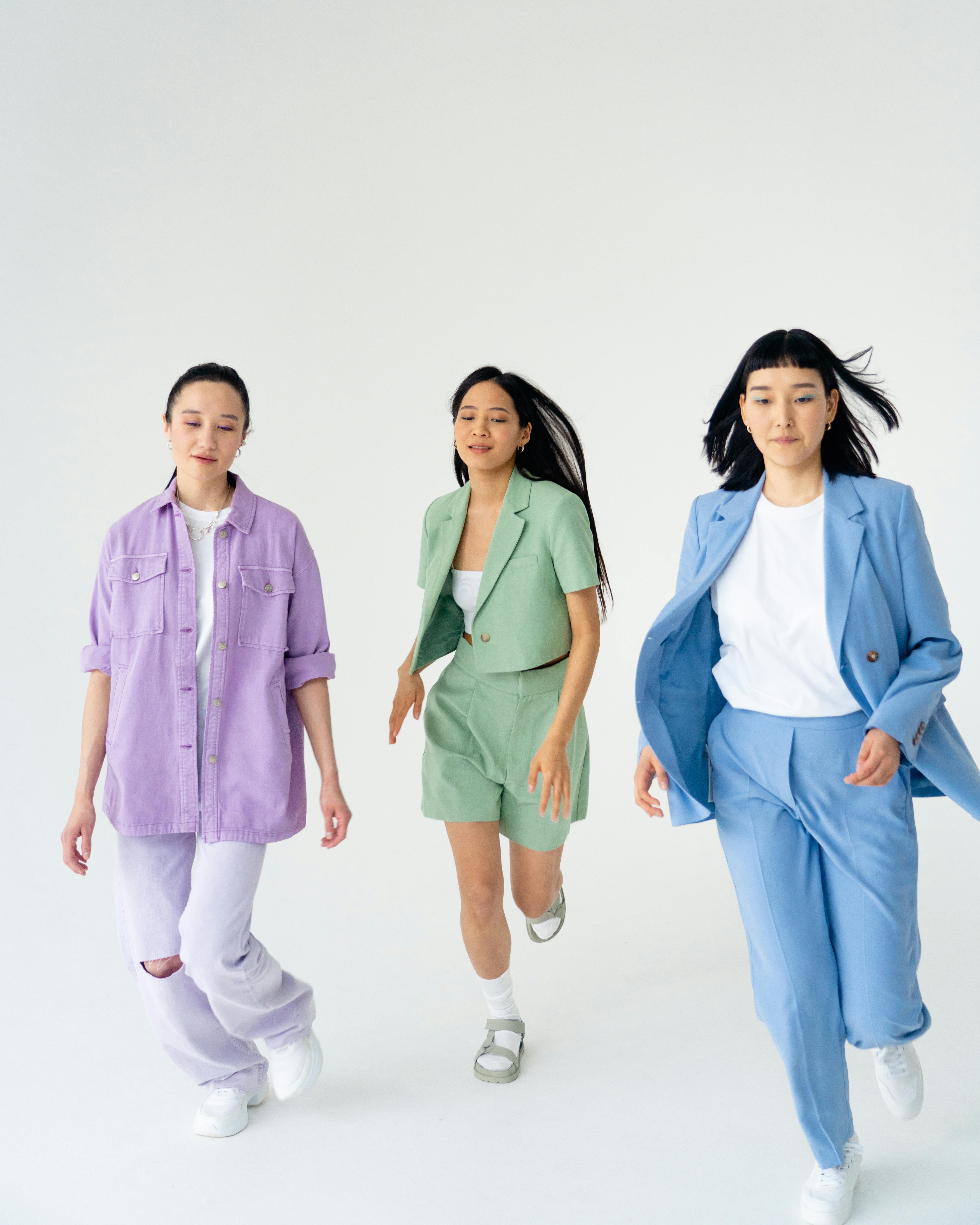 young women in trendy pastel outfits