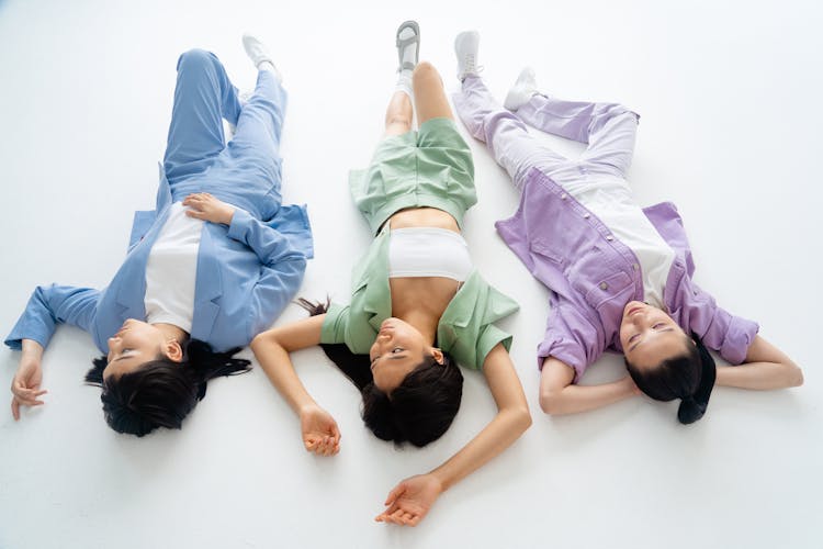 Women Wearing Casual Outfit Lying On The Floor