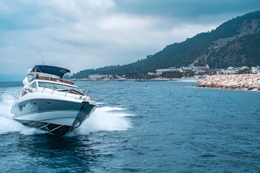 A luxury yacht glides through the blue waters off the coast of Antalya, Türkiye, with scenic mountains in the background.