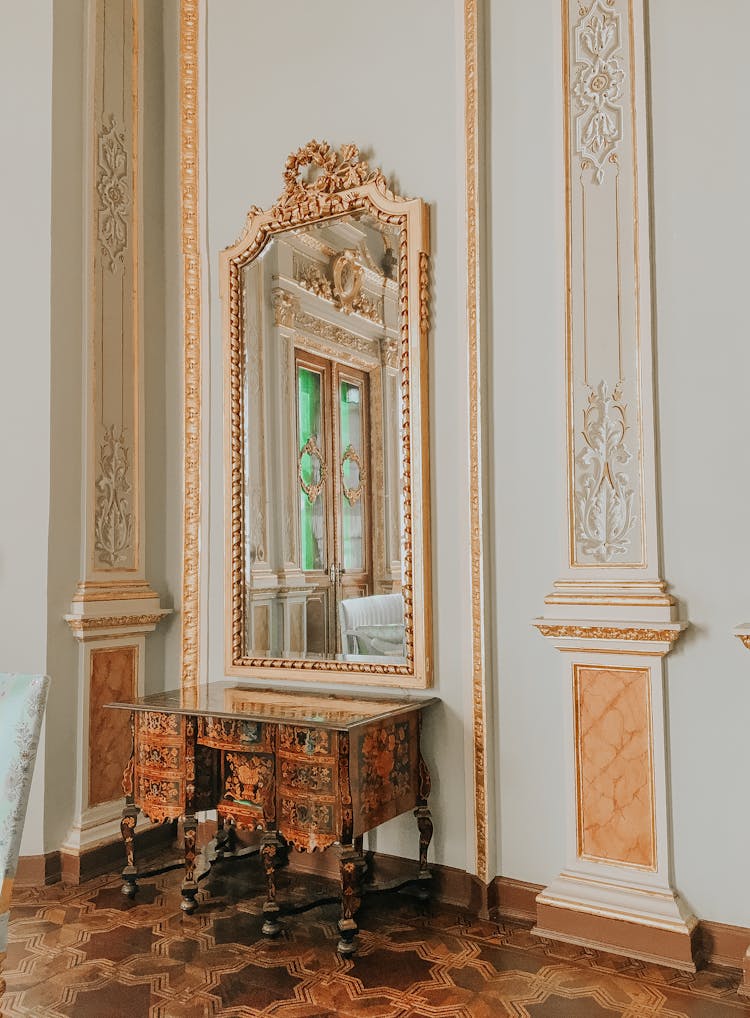 White And Gold Palace Interior With Marquetry In Wooden Cupboard And Floor