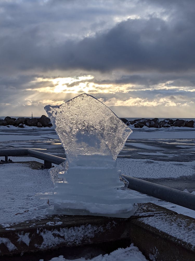 An Ice Sculpture On Snow Covered Concrete Floor