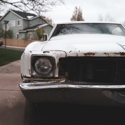Free Old Rusty White Car on the Street Stock Photo