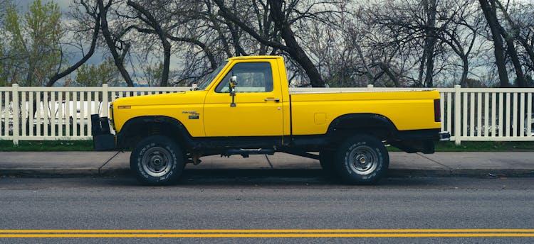 Yellow Truck Parked On The Road