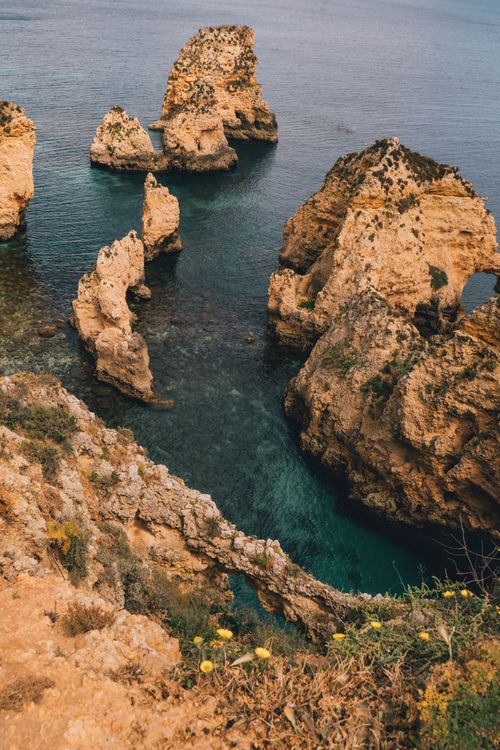 Free Breathtaking view of rocky cliffs and Atlantic Ocean in Algarve, Portugal. Stock Photo