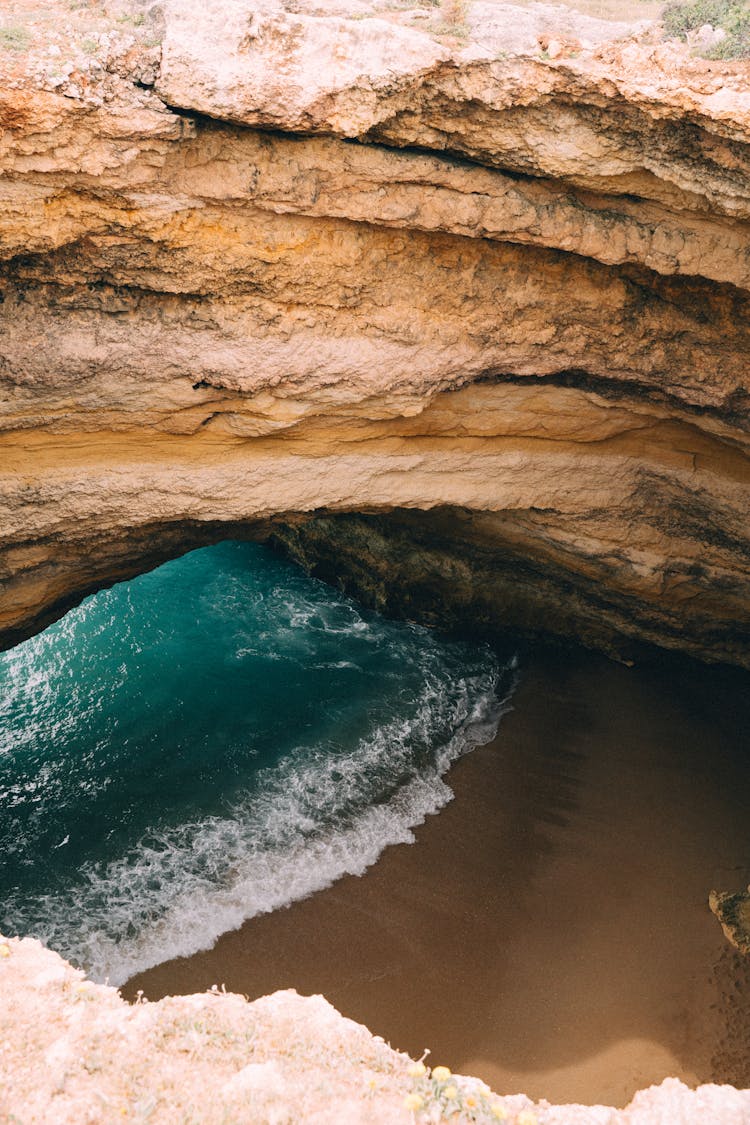 Sea Wave In Rocky Cave