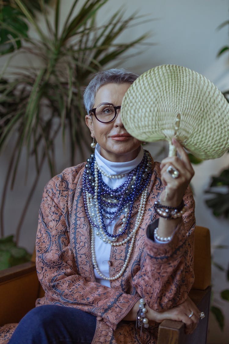 Photo Of Woman Holding A Fan