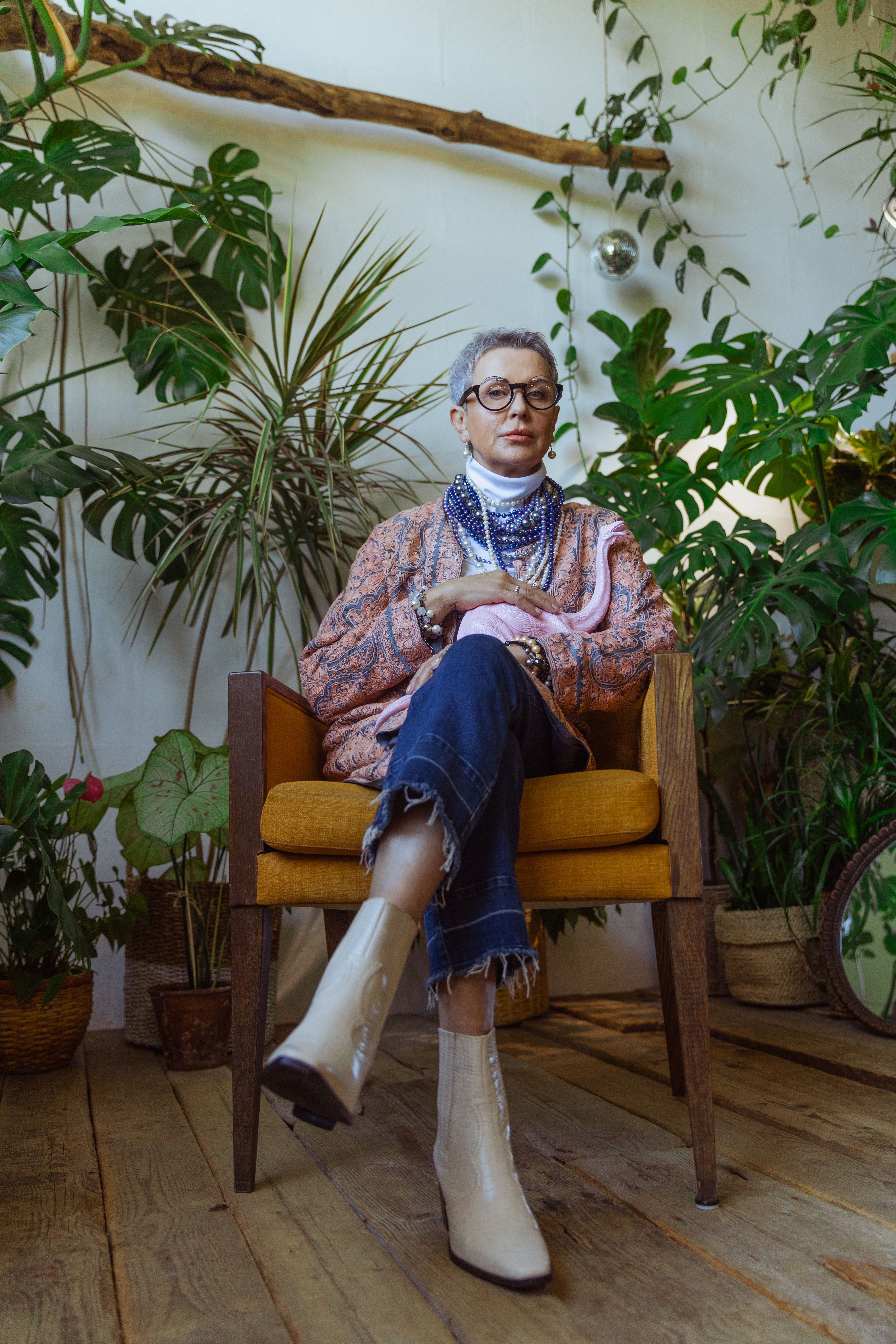Photo of Chic Grandma Surrounded by Indoor Plants · Free Stock Photo