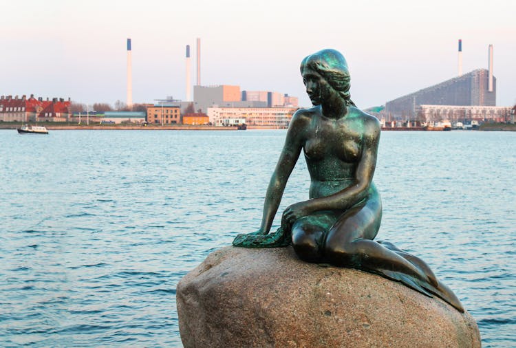 The Statue Of The Little Mermaid On A Rock In Copenhagen, Denmark