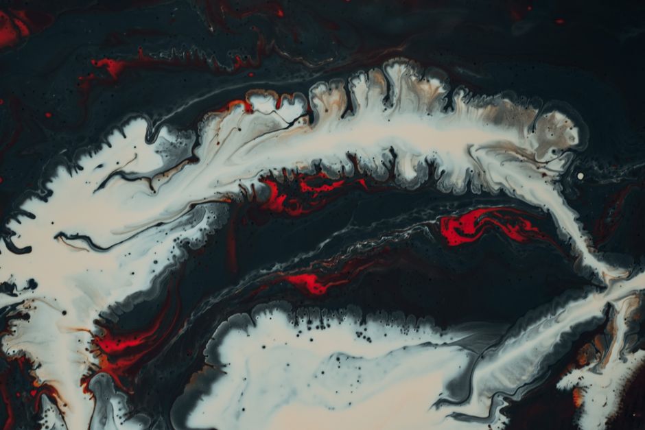 Dynamic fluid art piece with striking red, black, and ivory marbling effects creating a mesmerizing pattern.