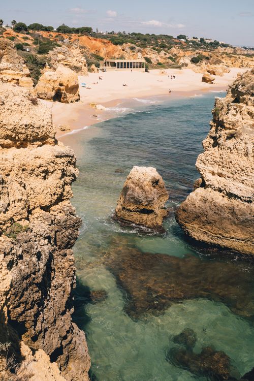 Free Discover the stunning cliffs and blue waters along Portugal's Algarve coast during summer. Stock Photo
