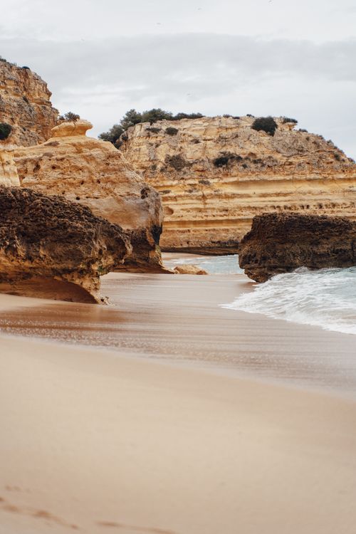 Free Beautiful seaside landscape featuring majestic rock formations and a serene shoreline, perfect for summer exploration. Stock Photo