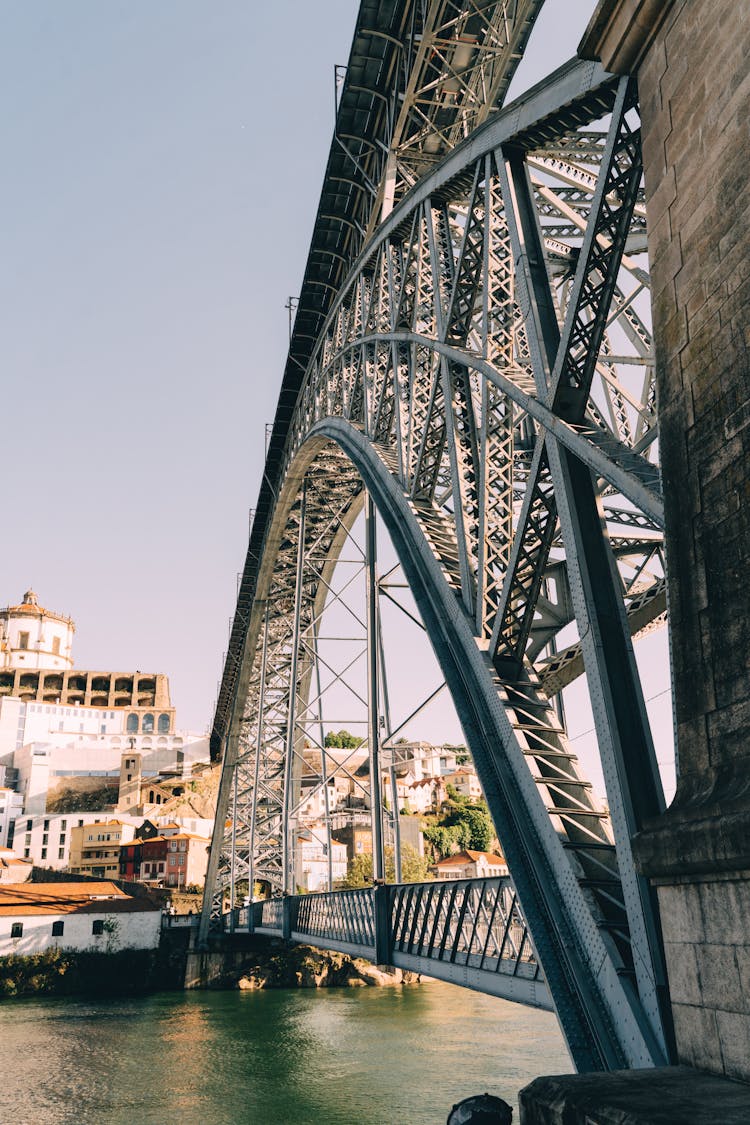 A Metal Bridge With Arch Shaped Below