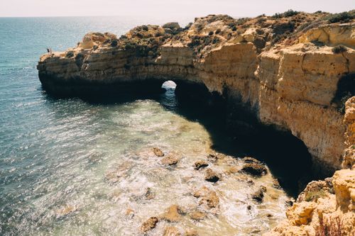 Free Beautiful coastal rock formations with ocean view in Algarve, Portugal. Stock Photo