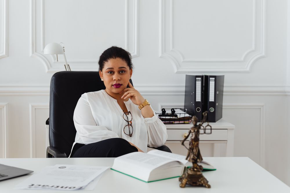 Portrait of a lawyer sitting confidently in a modern office