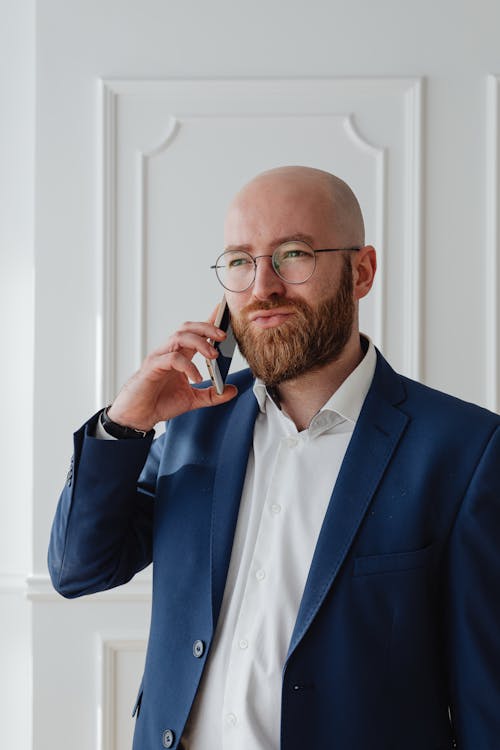 Man in Blue Suit Wearing Eyeglasses