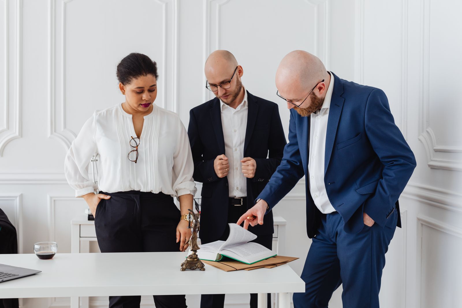 Attorneys reviewing case documents together in a law office