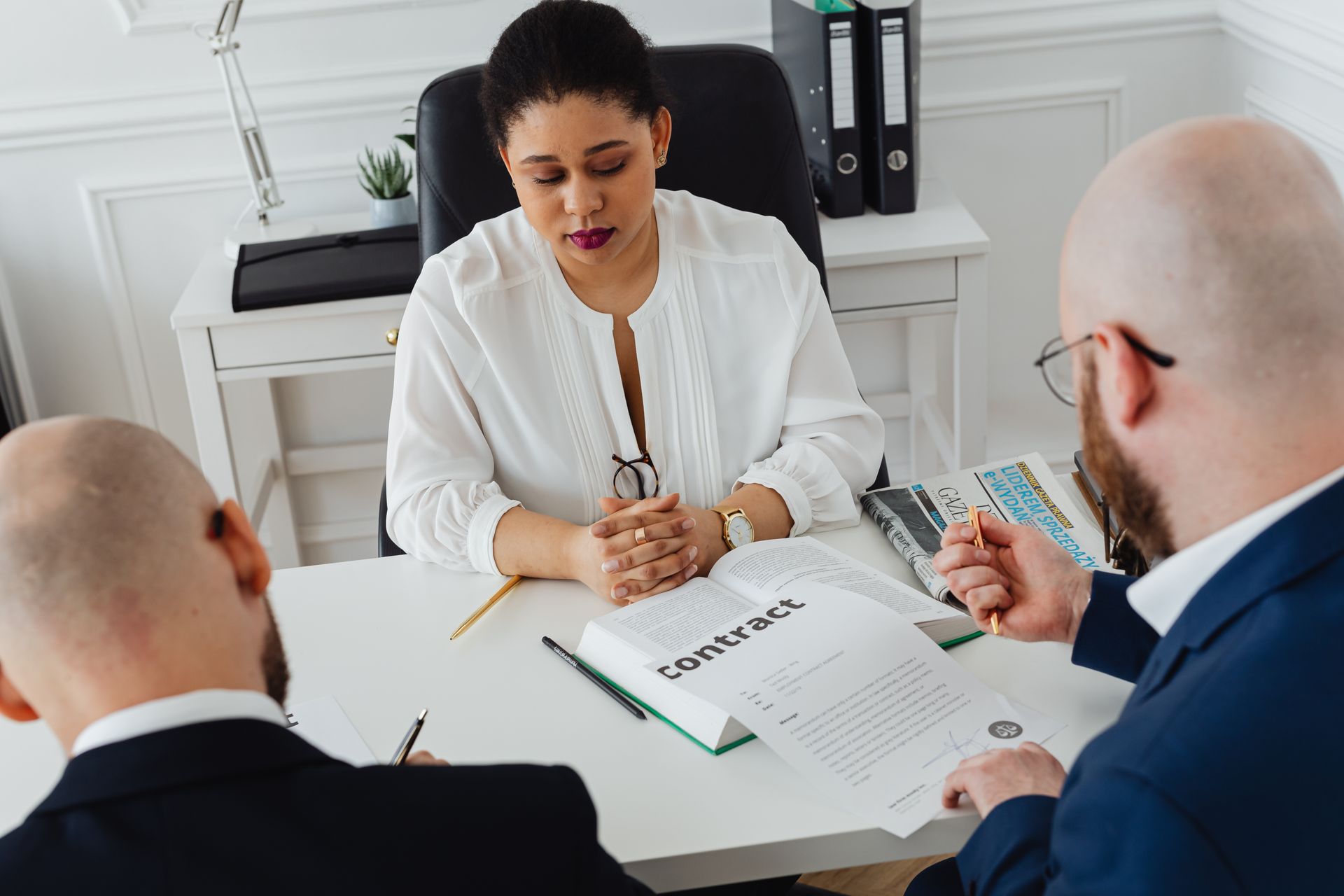 Bald Man Looking at the Contract
