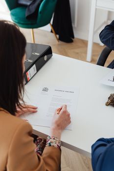 A Person Signing a Divorce Decree