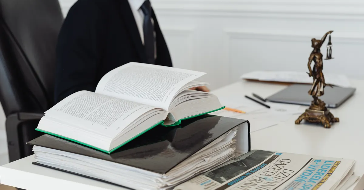 Stacked legal volumes on a desk