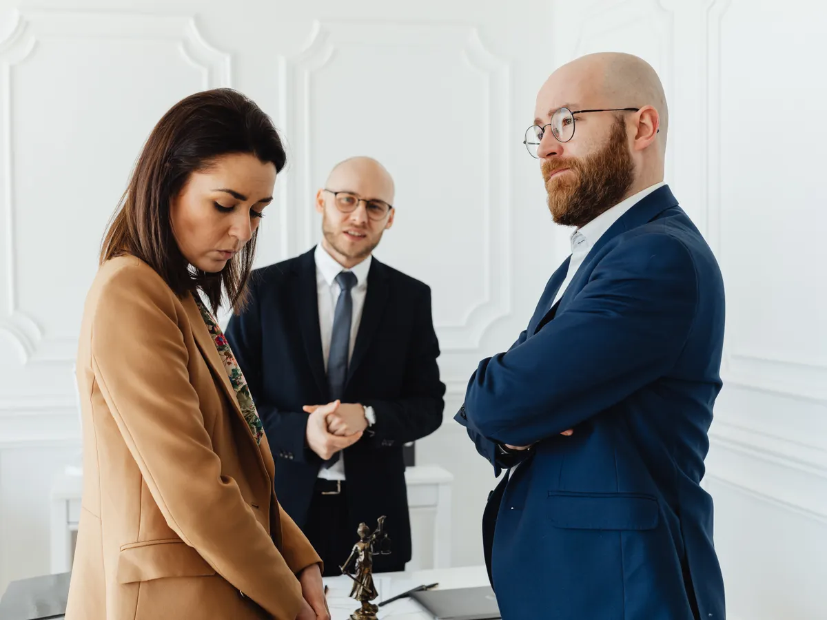 A lawyer consulting with a client, discussing the details of their case and the process of applying for anticipatory bail.