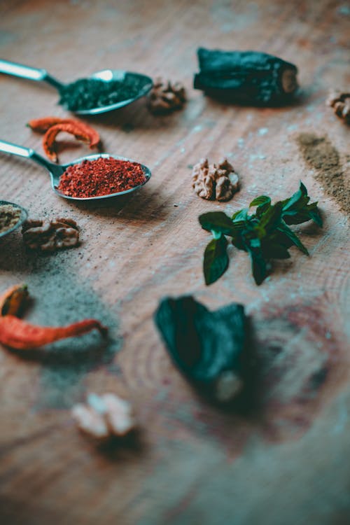 Free Herbs and Spices on Wooden Surface  Stock Photo