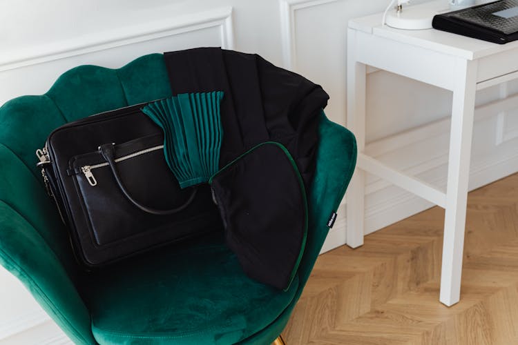 Black Leather Handbag On The Accent Chair 