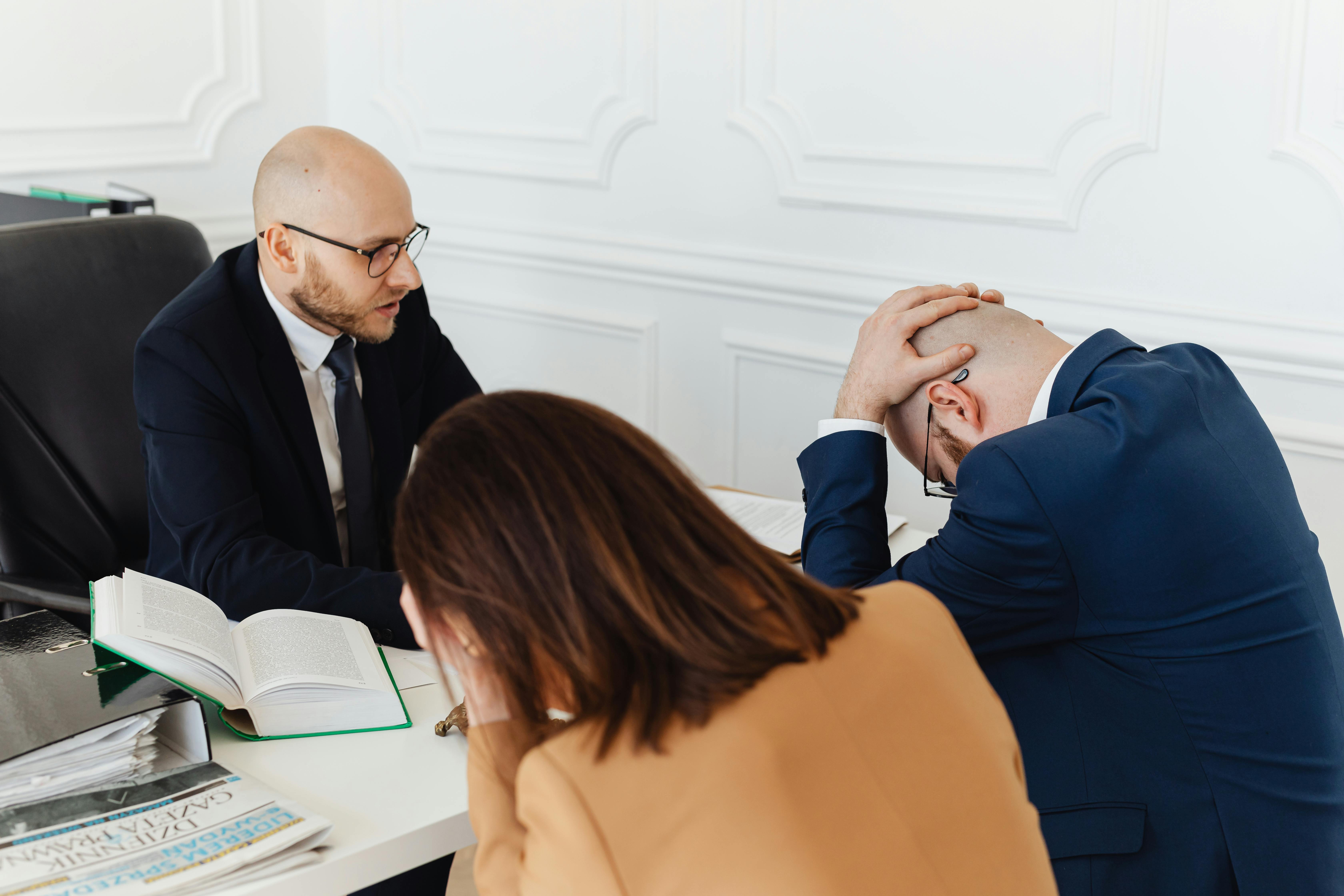 a lawyer talking to his clients