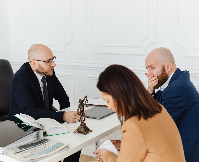 A notary public assisting clients in a professional office setting