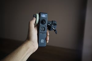 Hand of person with camera stabilizer control panel